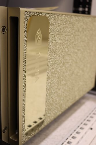 A gold circuit board showing NVidia's logo.
